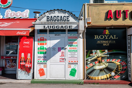 Baggage Safekeeping in Split, Croatia, surrounded by a Coca-Cola stand and a casino