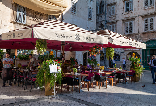 NoStress Bistro on Narodni (People's) Square in Split, Croatia, with waiters and other people visible