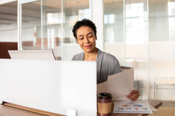 istock woman reading report 1334833436