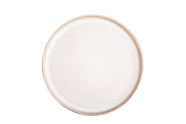 istock Beige ceramic plate on a white background. Isolated 1334833873