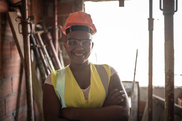 istock Portrait of a female construction worker at a construction site 1334834080