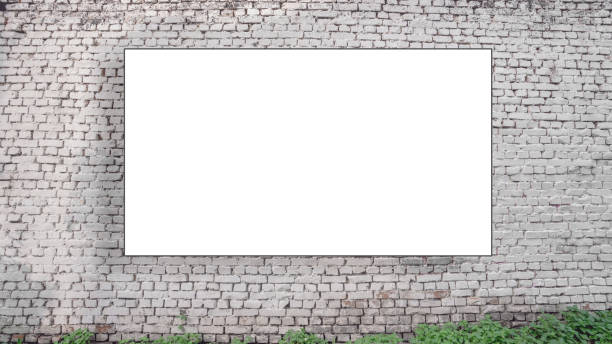 istock Huge empty mockup hanging on old vintage white brick wall 1334838639