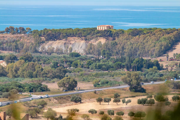 A two-story villa sits on the coastline of the Mediterranean Sea near Agrigento, Sicily