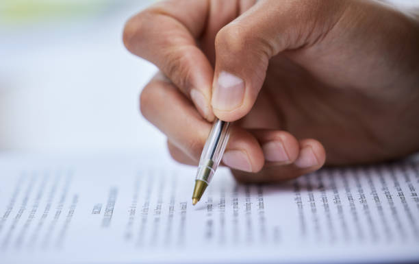 istock Closeup shot of an unrecognisable man going through paperwork 1334839438