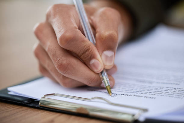 istock Closeup shot of an unrecognisable man going through paperwork 1334839440