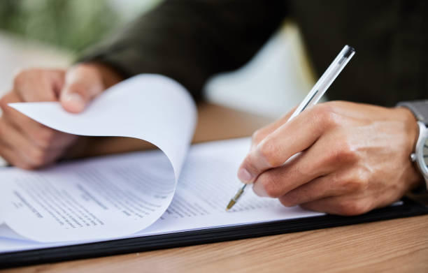 istock Closeup shot of an unrecognisable man going through paperwork 1334839441
