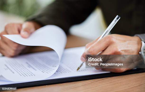 Closeup Shot Of An Unrecognisable Man Going Through Paperwork Stock Photo - Download Image Now