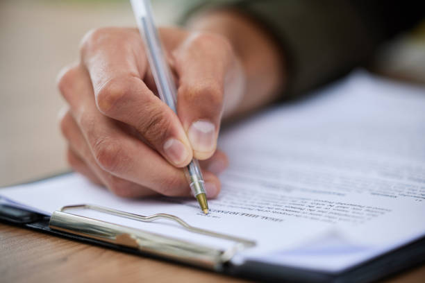 istock Closeup shot of an unrecognisable man going through paperwork 1334839443