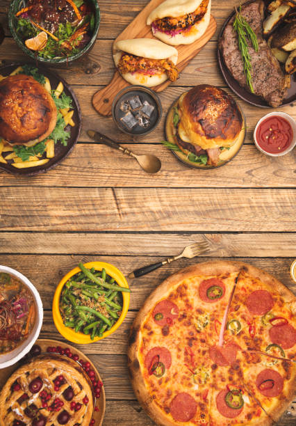 istock Dinner frame with bunch of food on table. 1334843435