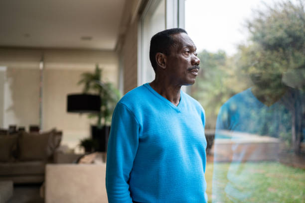 istock Senior man contemplating at home 1334849438