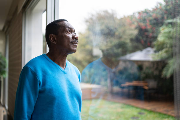 senior man contemplating at home - senior adult african descent men black imagens e fotografias de stock