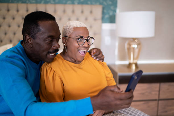 istock Couple doing a video call on smartphone at home 1334849512