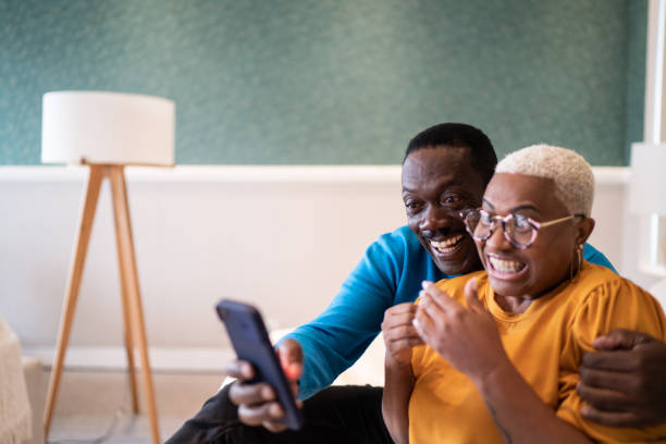 istock Couple doing a video call on smartphone at home 1334849780