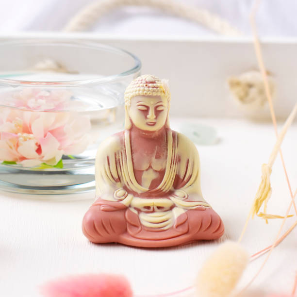 istock Decorative candle of Buddha statue on a white background. 1334849859