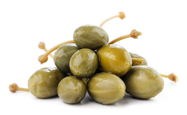 istock Heap of pickled capers on a white background. Isolated 1334850038