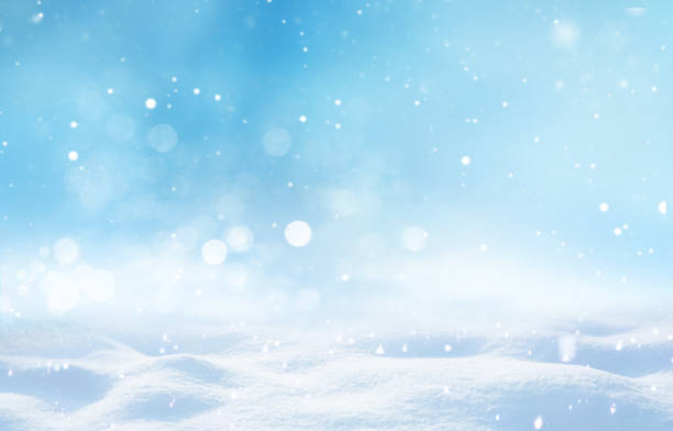 istock Beautiful light winter snowy background with snowdrifts. 1334852059