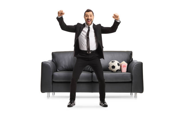 retrato de cuerpo entero de un hombre de negocios emocionado con un fútbol animando y gesticulando felicidad - suit soccer men sport fotografías e imágenes de stock