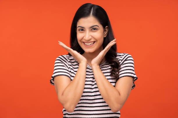 istock Young woman on yellow background 1334852104
