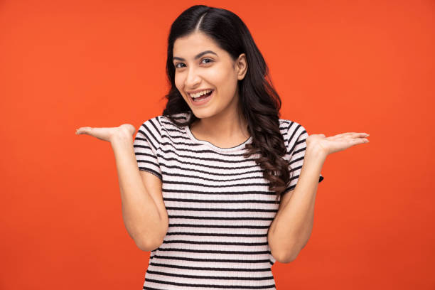 istock Young woman on yellow background 1334852709