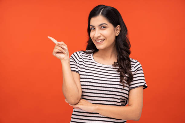 istock Young woman on yellow background 1334852760