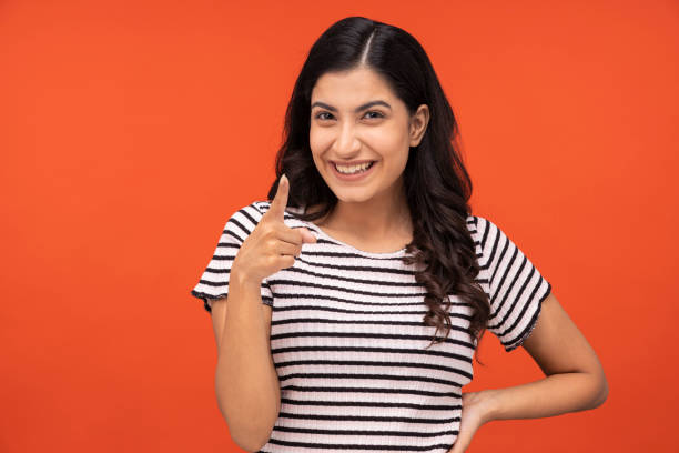 istock Young woman on yellow background 1334852986