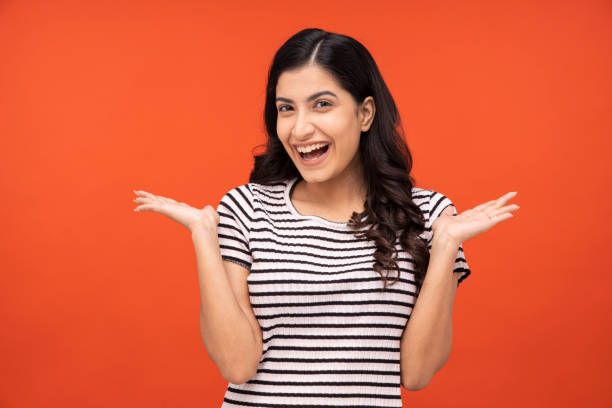 Young woman on yellow background