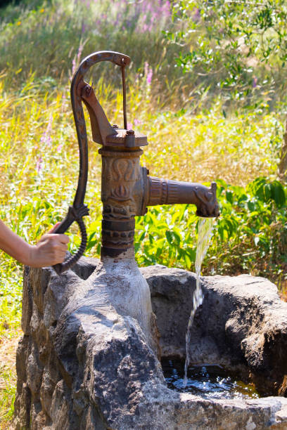 istock fountain with Mountain spring water in the mountains 1334856556