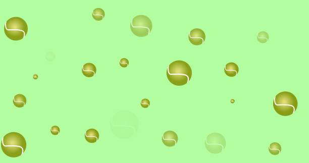 istock Composition of multiple tennis balls over green background 1334856777