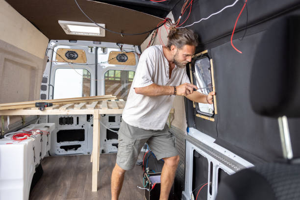 Man working on the interior of his camper van
