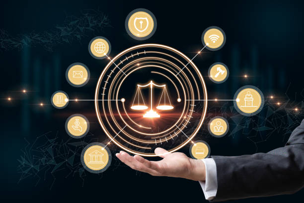 Businessman holding the icon of the balance of justice. Concept of legal advice, law and defense and of providing legal services and defense in court. stock photo