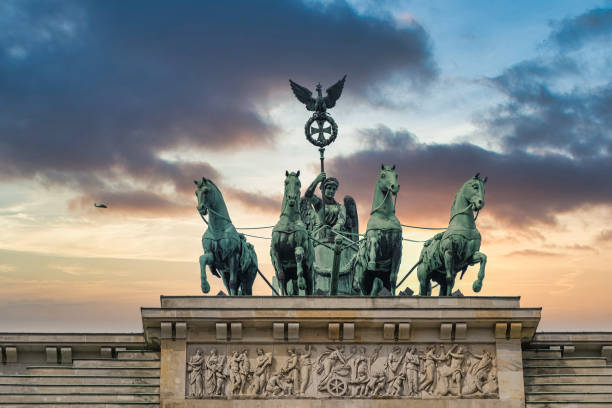 istock Brandenburger Tor monument statue at the top, Germany 1334864680