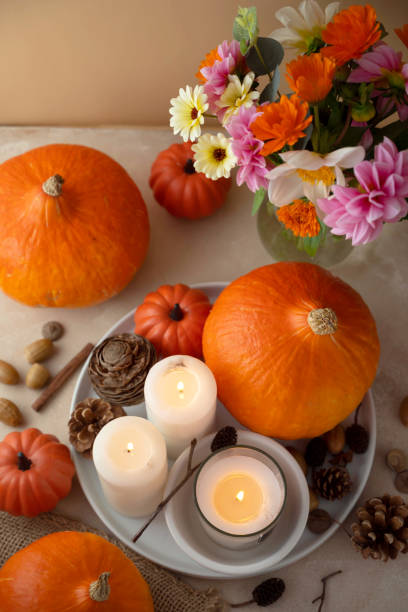 istock Autumn centrepiece, candles, autumn flowers and pumpkins 1334866410