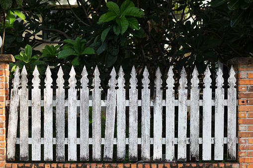 Grunged old wooden white fence