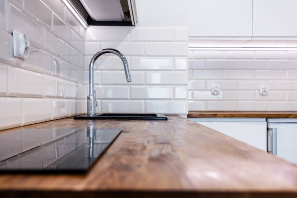 istock New clean kitchen with wooden table top 1334866872