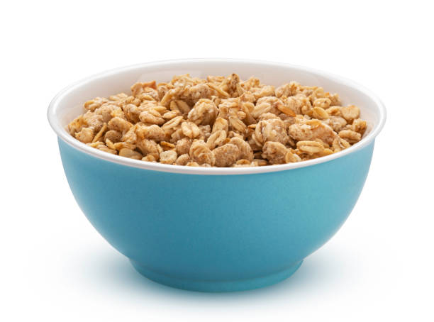 гранола, хрустящие мюсли, выделенные на белом фоне - bowl cereal cereal plant granola стоковые фото и изображения