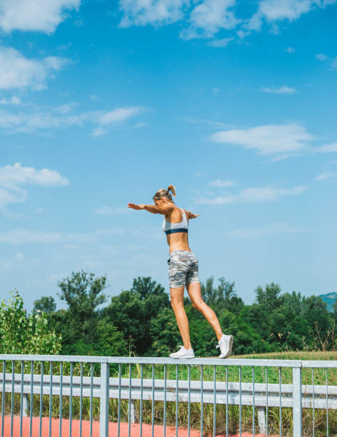 istock Young woman exercising outdoors 1334868338