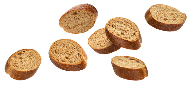 Falling slices of rye bread isolated on white background with clipping path
