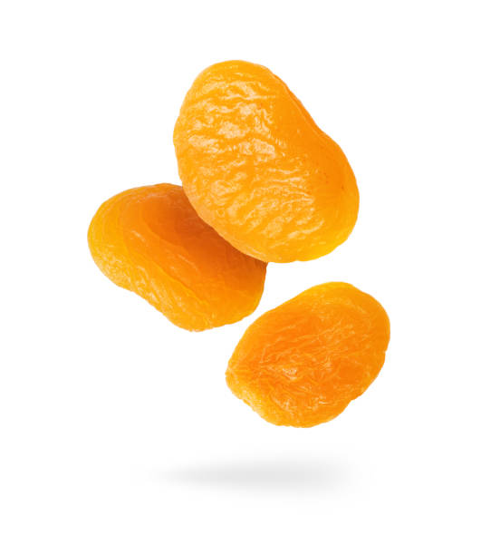 istock Dried apricots close up in the air on a white background 1334871480