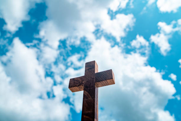 istock Blue Sky Background Wooden Cross 1334872560