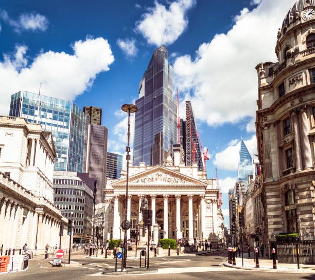 City of London Cityscape A view across a road junction to the Bank of England and Royal Exchange in the foreground, and the towers of the City of London's financial businesses in the background. bank of england stock pictures, royalty-free photos & images