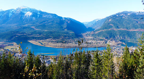 Columbia River, Revelstoke, British Columbia, Canada Revelstoke Valley located on the banks of the Columbia River, south of the Revelstoke Dam and near its confluence with the Illecillewaet River. revelstoke stock pictures, royalty-free photos & images