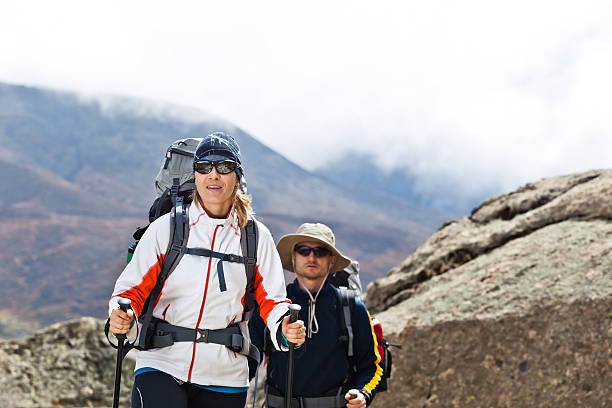 istock Woman and man hiking in mountains 133487798