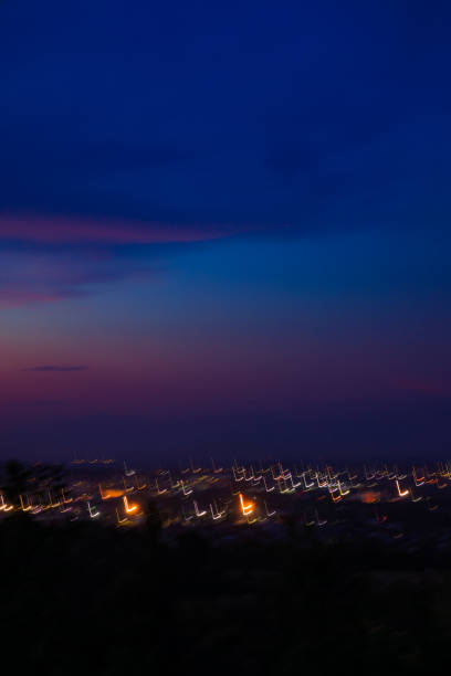night city light colorful blurry illumination after sunset time dusk vertical background concept photo