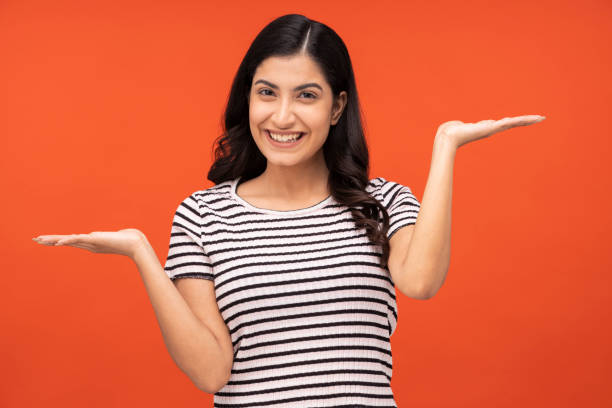 istock young woman on orange background, 1334881881