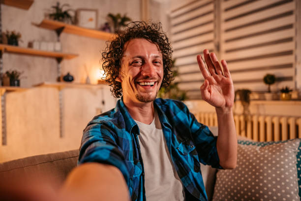 istock Man having video call with his friend using smart phone 1334882563