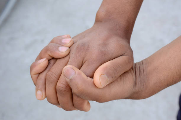 istock joint hands mental awareness health concept on the grey background. 1334884172