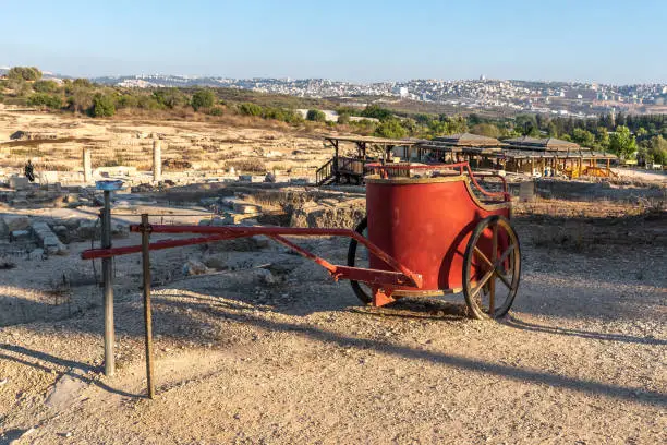 Red chariot and overview of the Nile house and Nazareth at Tzipori National Park in Israel