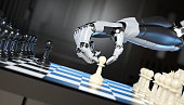 Robot's hand moving a pawn