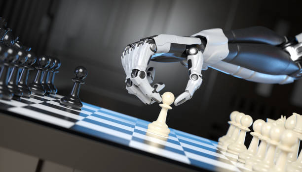 Robot's hand moving a pawn stock photo