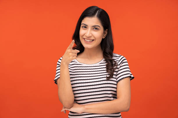 istock Young woman on yellow background 1334886492